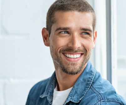 Man smiling  after periodontal therapy