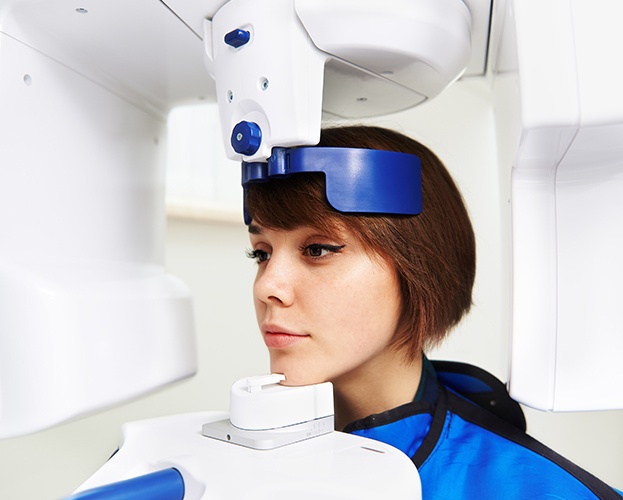 Woman receiving 3 d C T cone beam x-ray scan