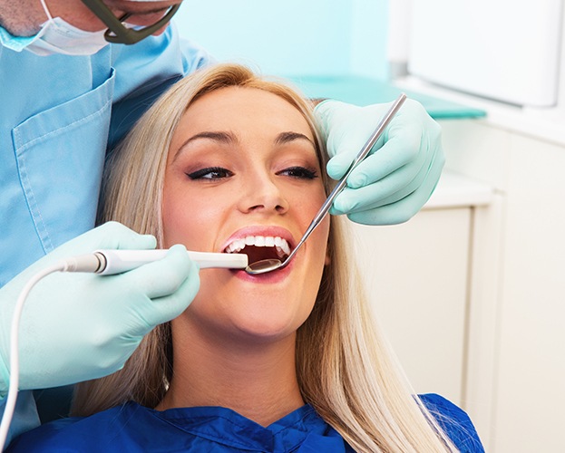 Woman receiving dental checkup