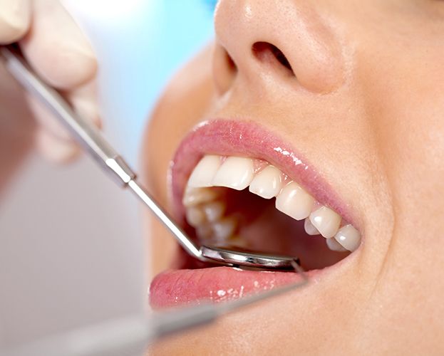 Patient receiving teeth cleaning