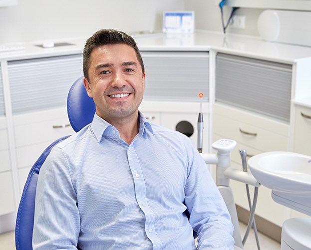 Smiling man in dental chair