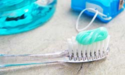 Closeup of toothbrush with toothpaste for preventing dental emergencies in Williamsville