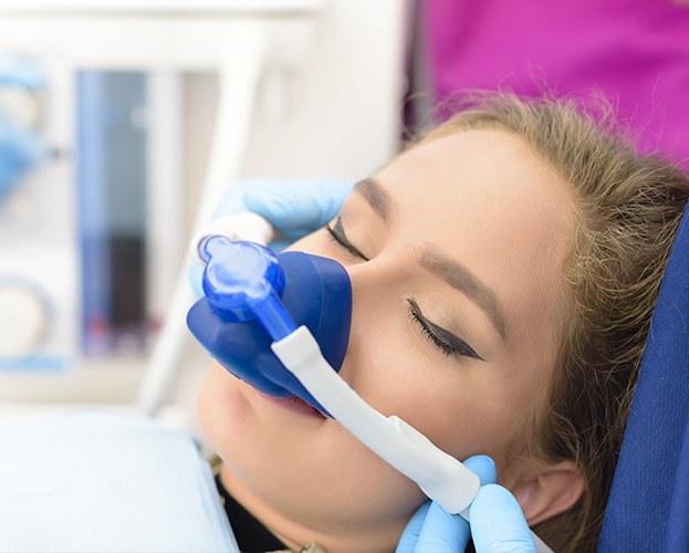 Woman with nitrous oxide dental sedation mask