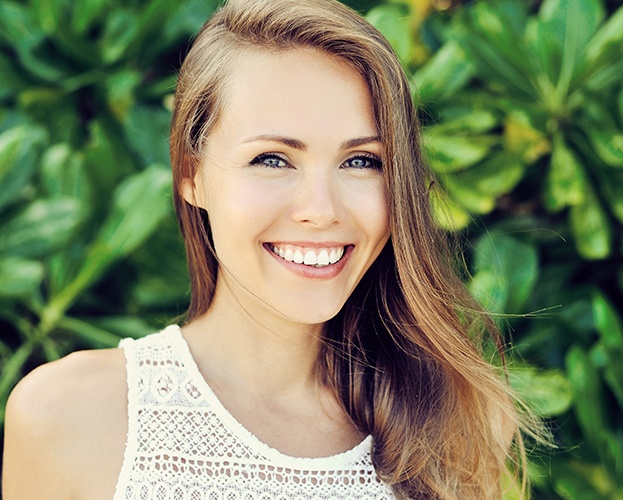 Woman with flawless smile after cosmetic dentistry