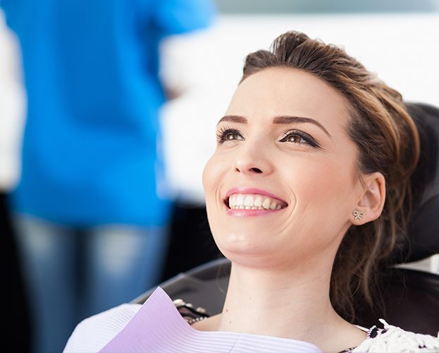 Woman smiling during preventive dentistry checkup