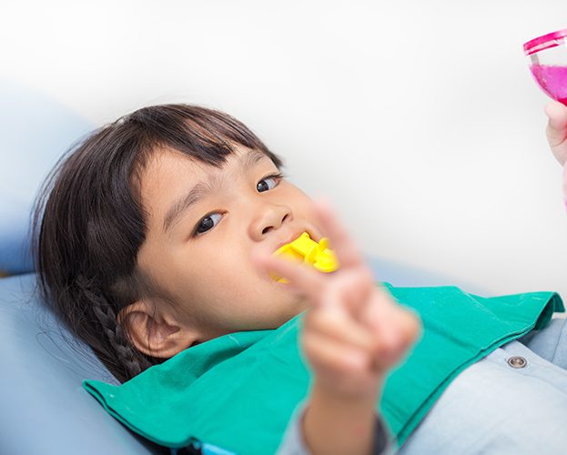 Young patient receiving fluoride treatment