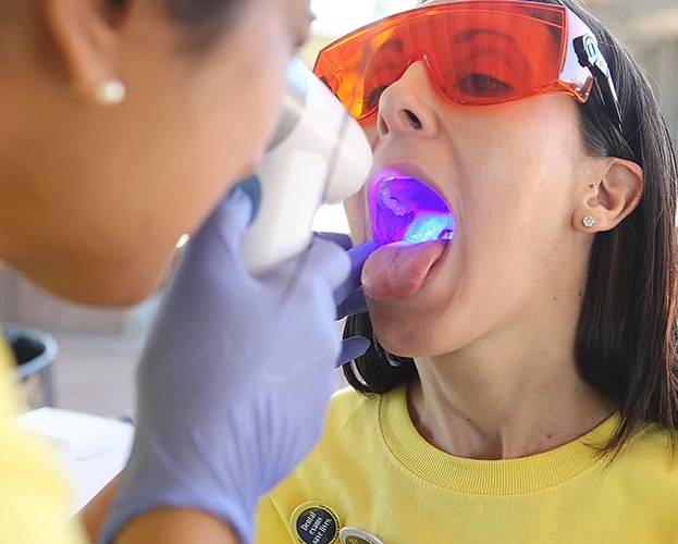 Patient receiving oral cancer screening