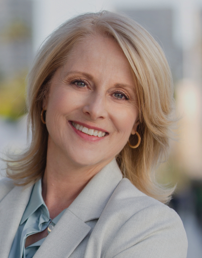 Woman in business attire smiling