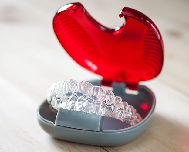 Set of clear aligners in carrying case