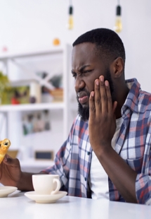 young woman smiling while visiting dentist 