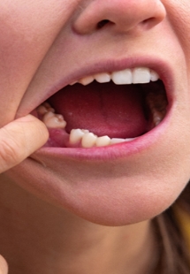 man smiling with arms crossed