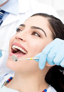 patient smiling while visiting dentist 