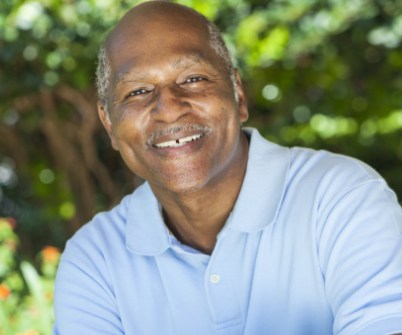 Senior man smiling after dental treatment