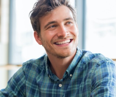 Man smiling after restorative dentistry