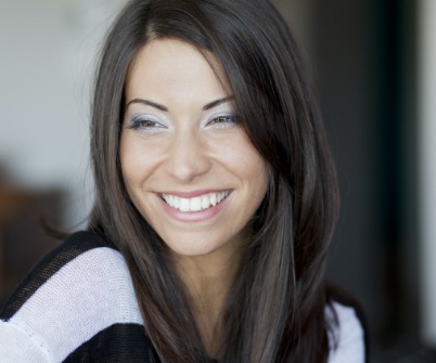 Woman with  beautiful smile after cosmetic dentistry