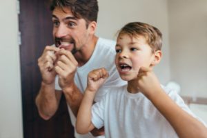 child flossing