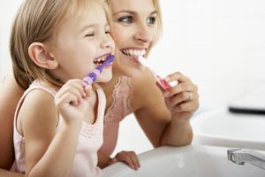 mother and child brushing