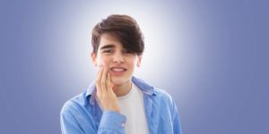 teenage boy during the first week of braces treatment